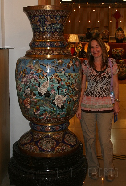 cloisonne11.jpg - There is my beautiful wife standing next to a really big vase.  We could have put her in the vase!