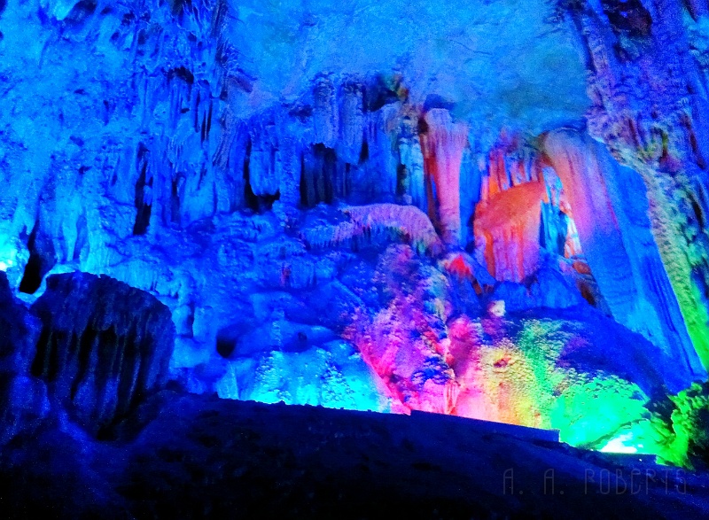 cave1.jpg - No we're in the Reed Flute Cave.  These colors are not retouched.  This is how they light the cave up.  It's beautiful.