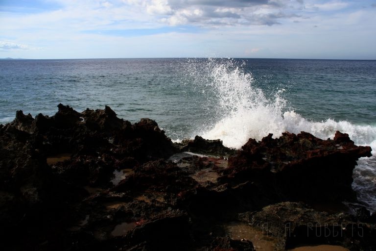 IMG_1410.jpg - The dark coral walls line many of the beaches.