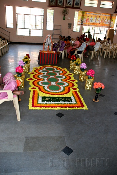 IMG_4969.JPG - This "welcome mat" is made by sprinkling flower petals on the floor.  The first day of the cermony is the reception.