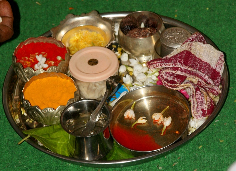 IMG_5336.JPG - This tray is full of sacred spices, herbs and stuff.  I think I was told tumeric and saffron were on that tray.